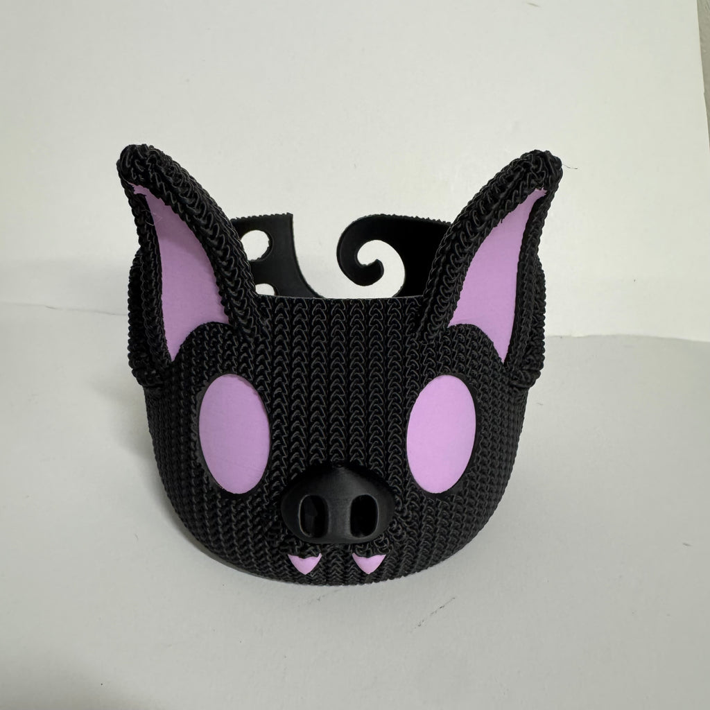 Barry the Bat 3D printed yarn bowl in black with light purple eyes, ears, and fangs