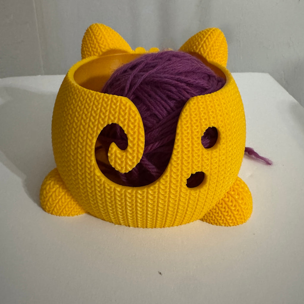 Stitches the Cat 3D printed knitted texture yarn bowl in matte yellow holding a purple yarn ball